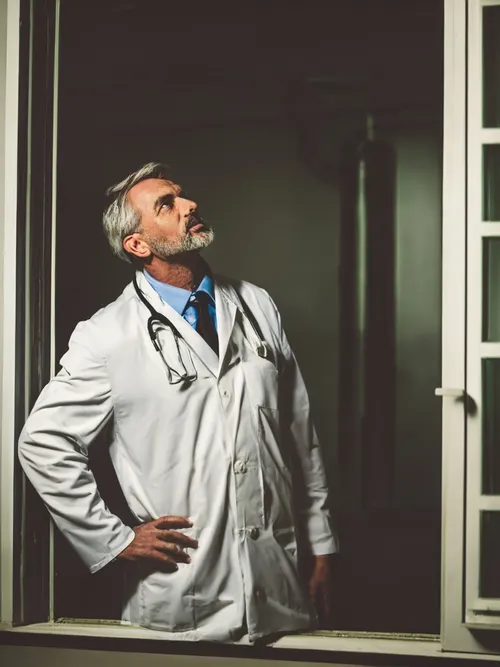 Pensive Doctor Portrait FREE Stock Photo, doctor,  healthcare,  medical picture